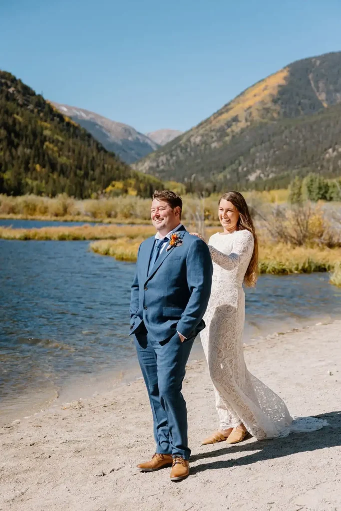 Couple shares a first look at a lake on their elopement day in Buena Vista Colorado