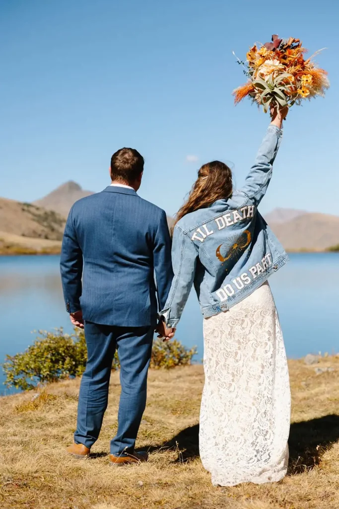 Couple elopes at a high alpine lake in the mountains of Buena Vista Colorado on a warm summer day
