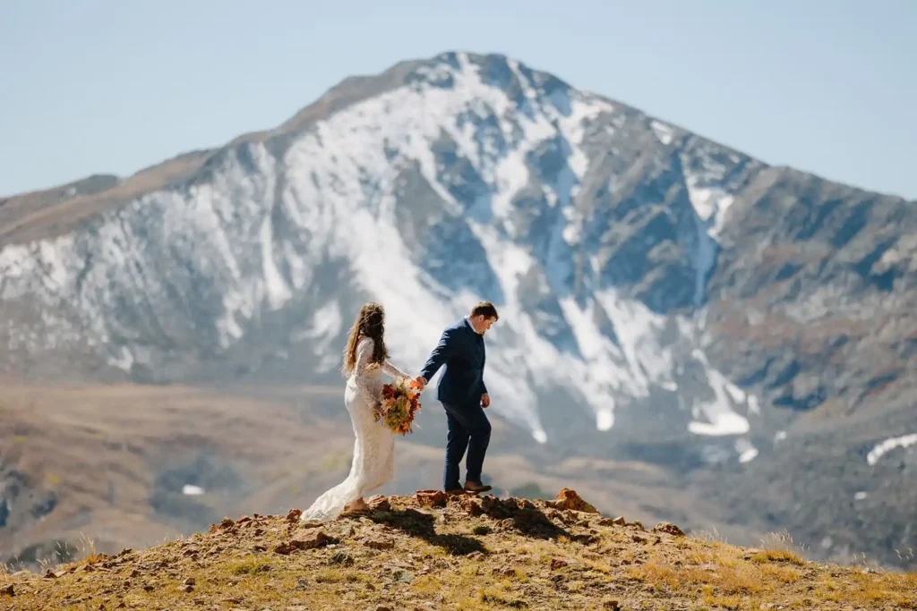 Scenic mountain views and an elopement couple hiking on their wedding day