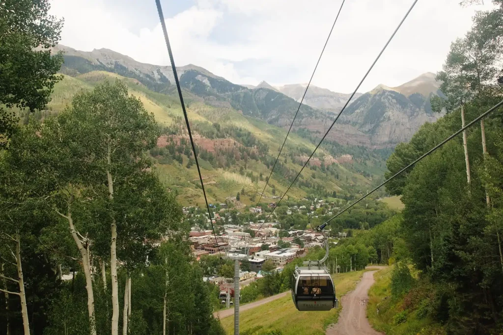 Scenic mountain views while taking the free gondola up to Mountain Village in Telluride Colorado. If you're wondering what to do in the summer in Telluride, consider this pretty day activity. 