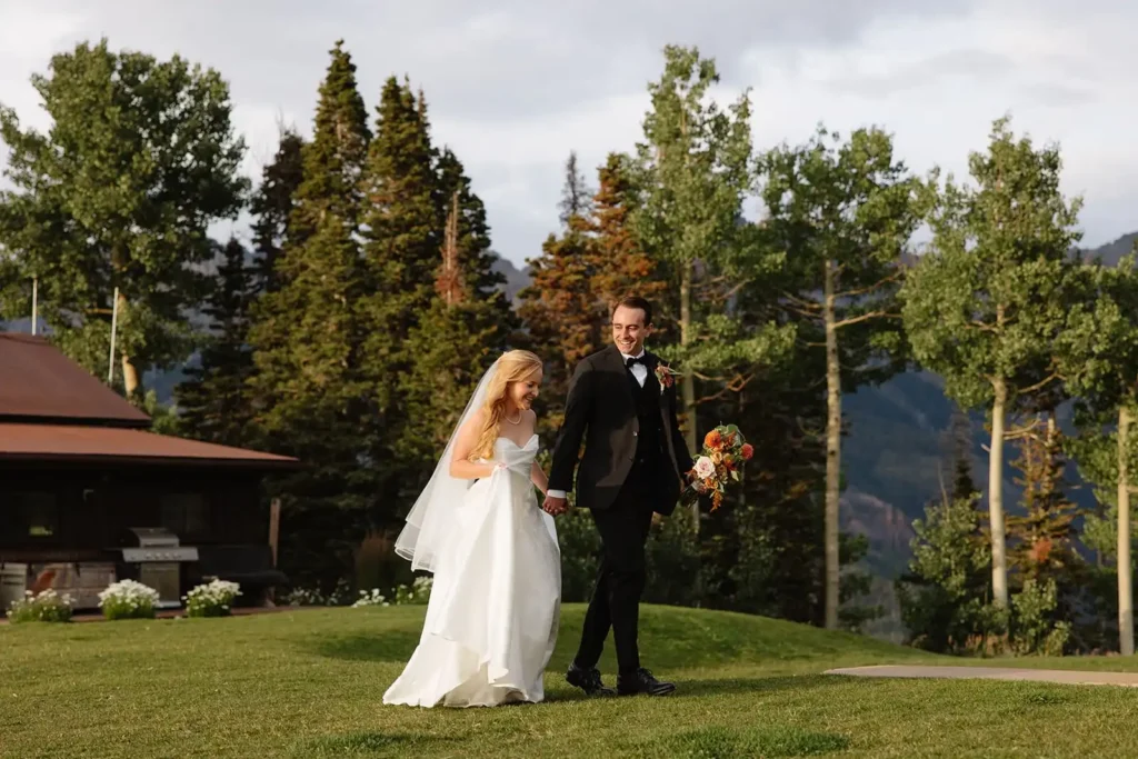 Leah Lach, a local Telluride wedding photographer captures stunning photo of bride and groom at golden hour sunset at the top of Telluride Mountain Resort. If you're planning a Telluride wedding, consider hiring Leah, a local photography expert! 
