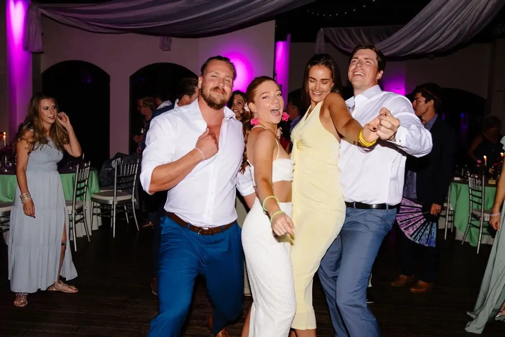 Candid dance floor photo of bride and groom