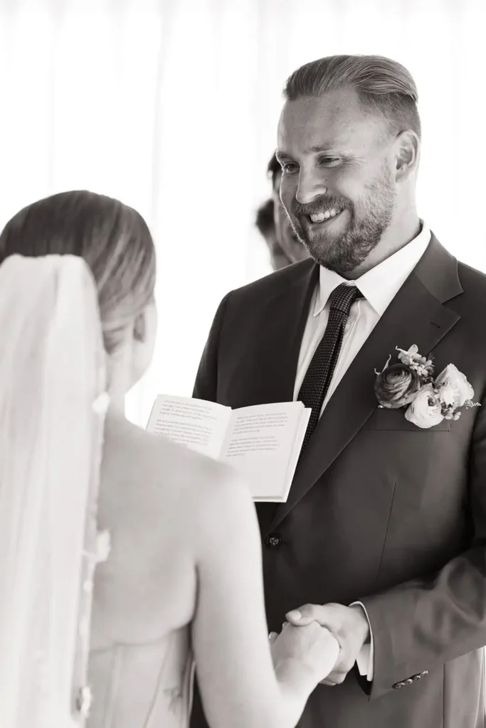 Bride and groom share a sweet moment exchanging vows during their Colorado wedding. Not all photos need to be specified on a wedding photography shot list