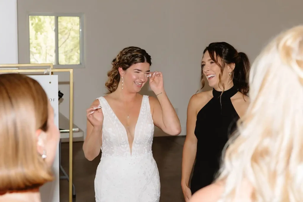 Candid moment of bride during a sweet bridesmaids first look at Vista View Events. Taken by a documentary style wedding photographer in Glenwood Springs Colorado