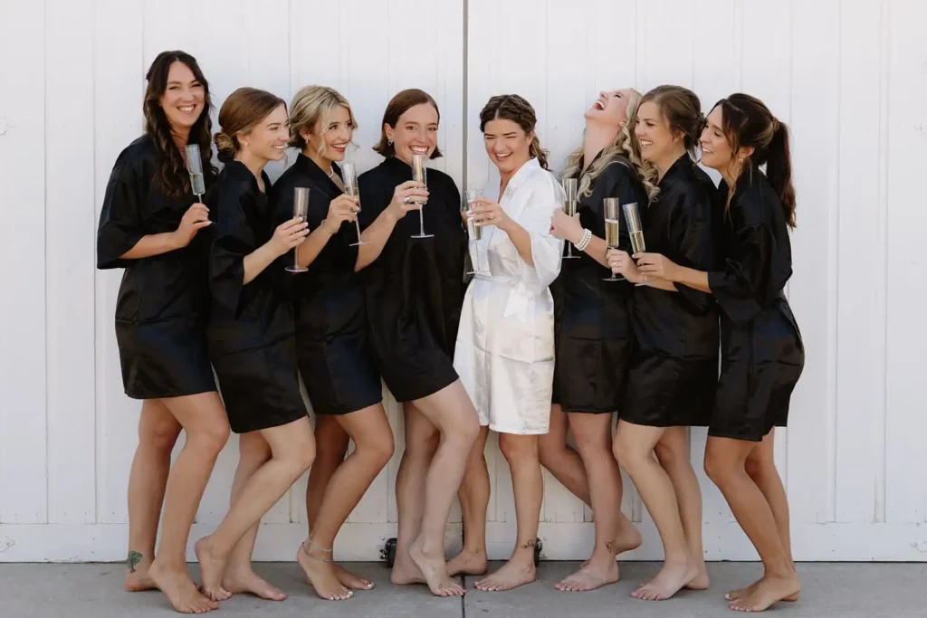 Getting ready wedding photos. Candid moment of bride laughing with her bridesmaids before the ceremony at this Colorado mountain wedding venue.