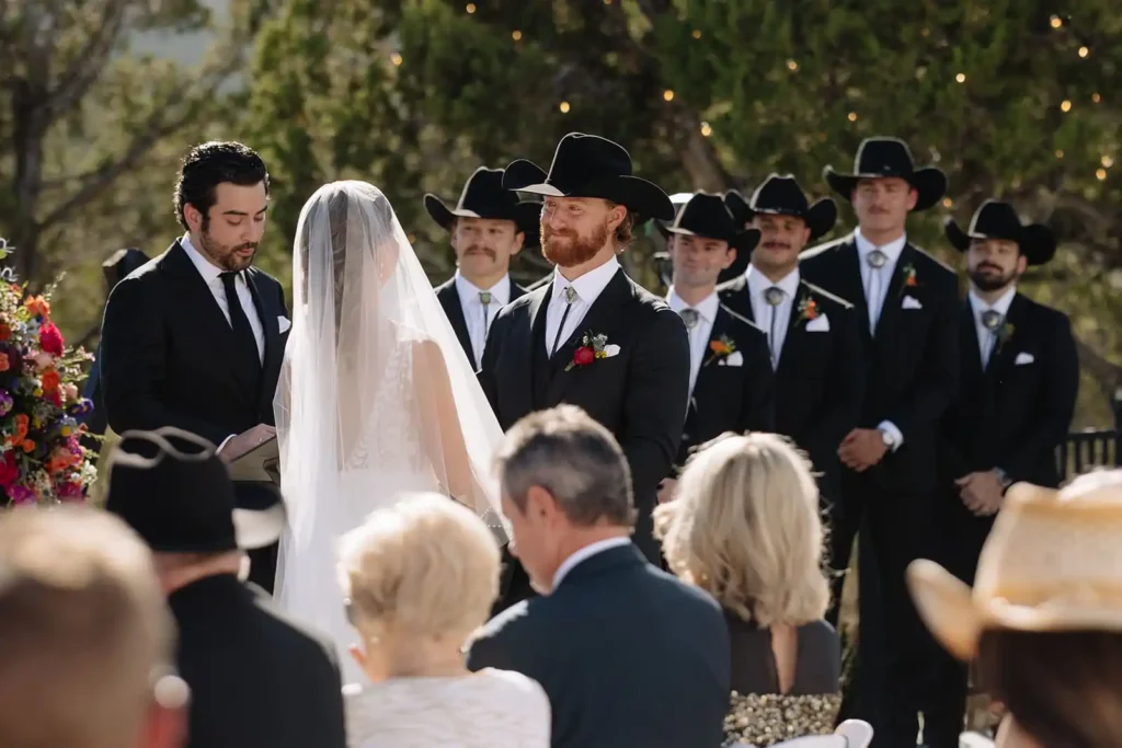 Guests seated with panoramic views of lake and mountains during Western-style ceremony.
