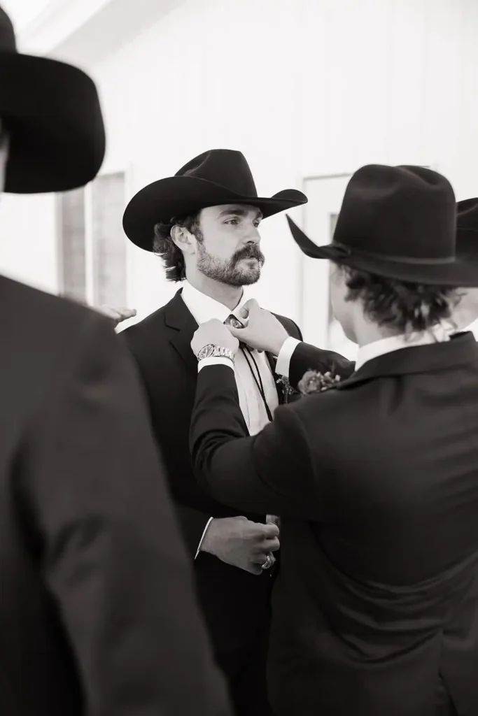 Groomsmen in Cowboy Hats at a Western Wedding in Colorado. Detail shot of cowboy boots and bolo ties worn by groomsmen for a Vista View Events wedding.