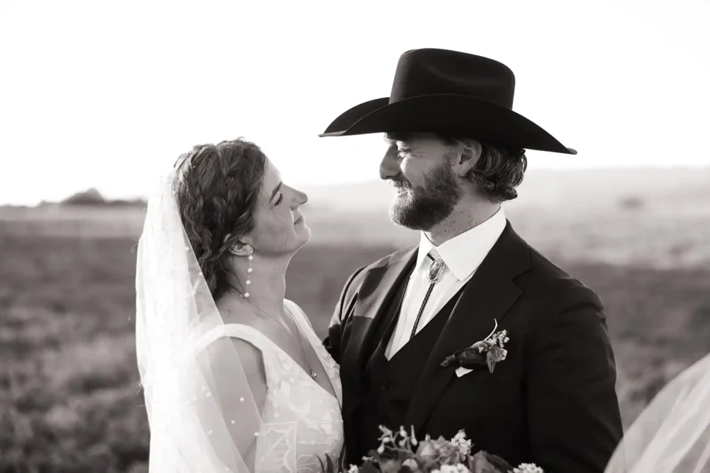 Natural, relaxed portraits of bride and groom away from guests at sunset.