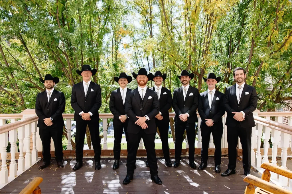 Groomsmen pose for a photo in Glenwood Springs Colorado at Hotel Colorado before wedding at Vista View Events