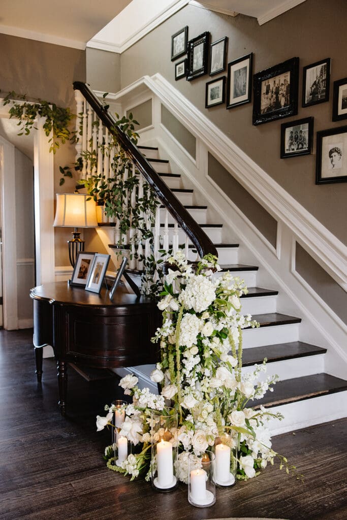 Floral installation covering the grand staircase at The Manor House wedding in Littleton, Colorado